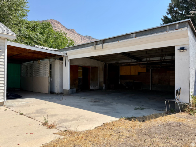 151 South Roosevelt Helper, UT 84526 - Photo 10 of 20 Concrete driveway leading to a multi-bay garage structure