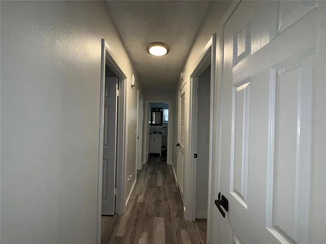 a view of hallway with chandelier