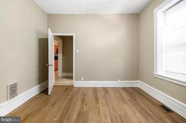 a view of wooden floor in an empty room