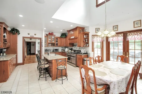 a large kitchen with a table and chairs