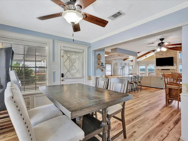 a view of a dining room with furniture window and wooden floor