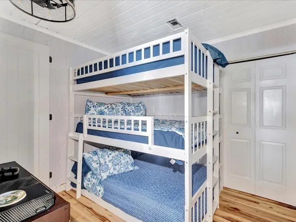 a bed room with a bed and a book shelf