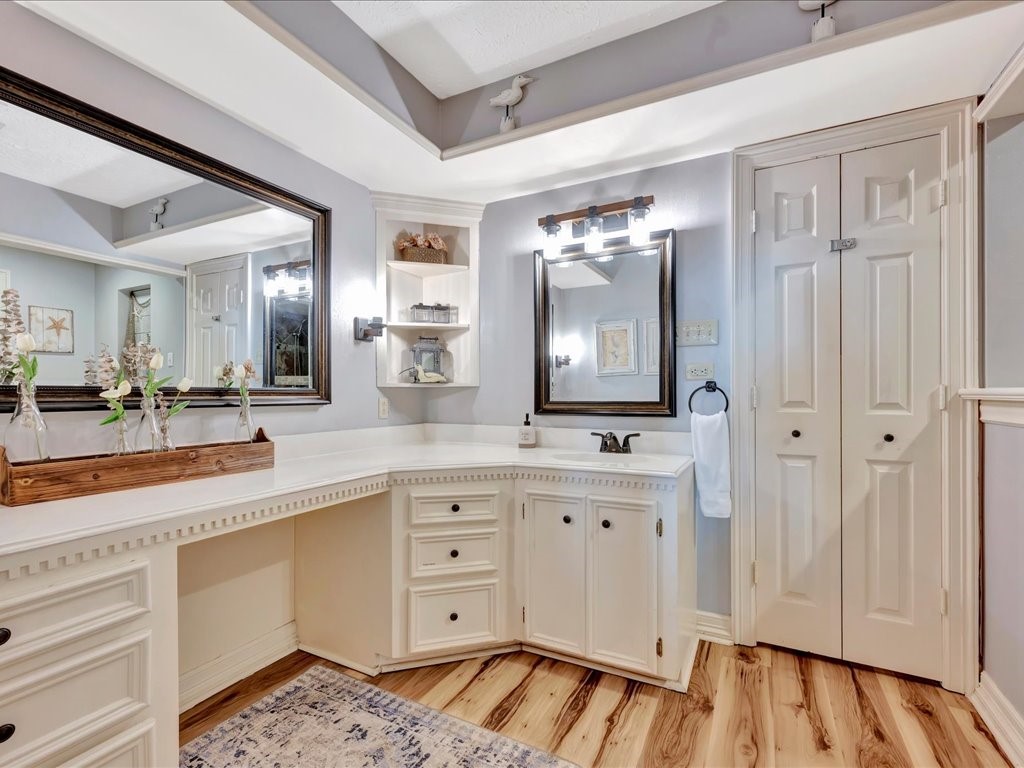 115 Harbor Add Drive Livingston, TX 77351 - Photo 19 of 44 a spacious bathroom with a sink and a mirror