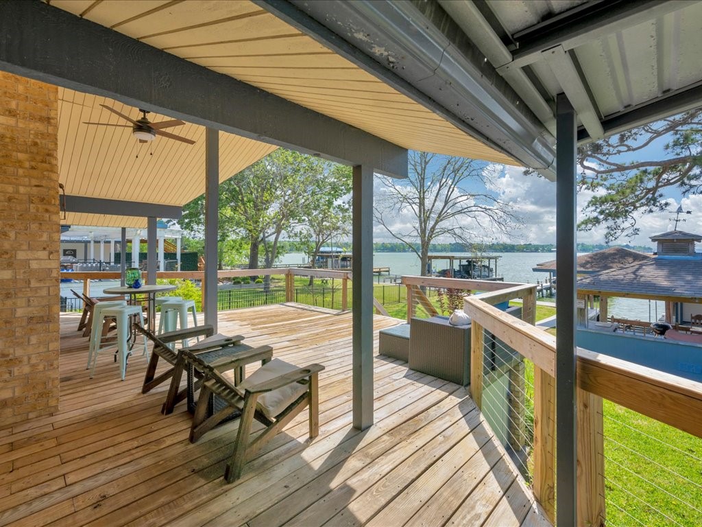 115 Harbor Add Drive Livingston, TX 77351 - Photo 31 of 44 a view of a balcony with chairs and wooden floor