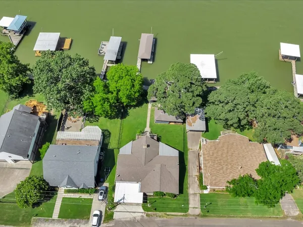 an aerial view of a house with a garden and swimming pool