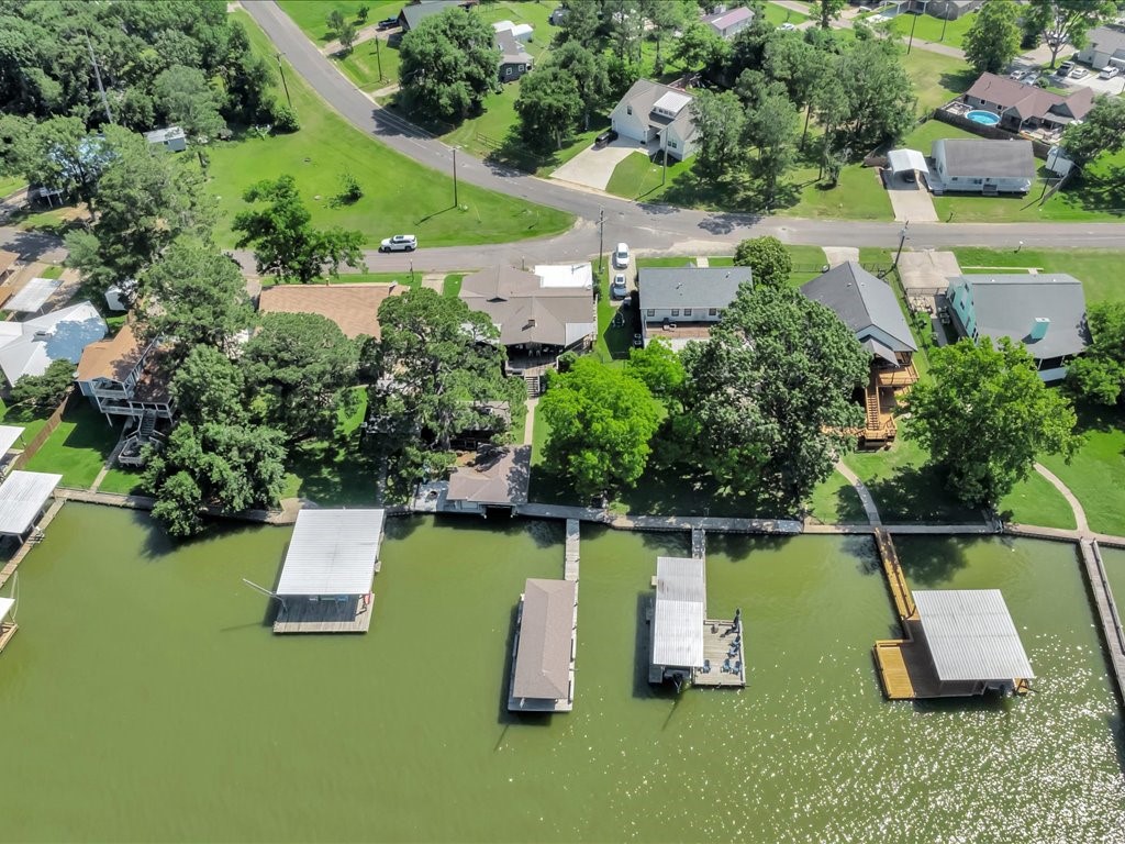 115 Harbor Add Drive Livingston, TX 77351 - Photo 34 of 44 an aerial view of a house with a garden and swimming pool