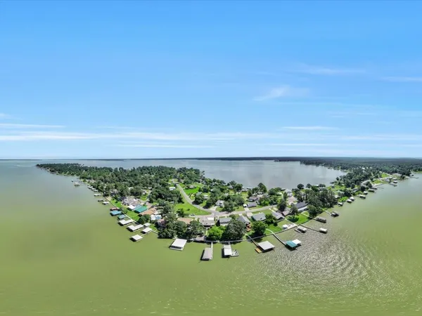 a view of a lake with a yard