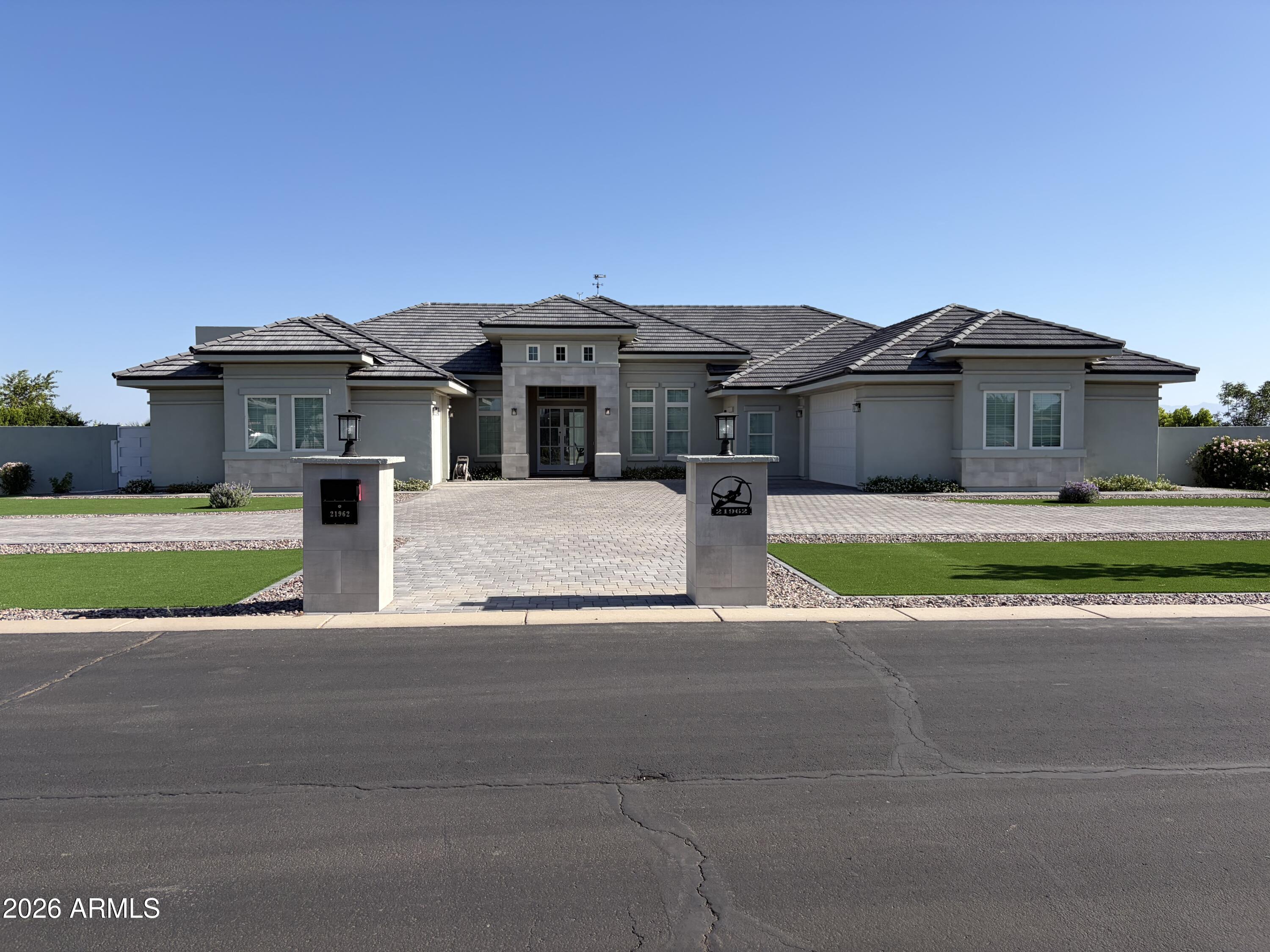 21962 East Stacey Road Queen Creek, AZ 85142 - Photo 1 of 10 a front view of a house with a garden and yard