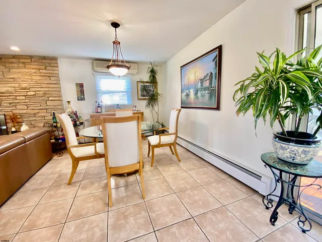 a bedroom with furniture and wooden floor
