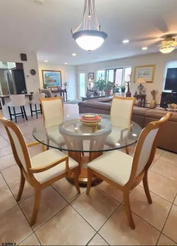 an empty room with wooden floor and a bathroom