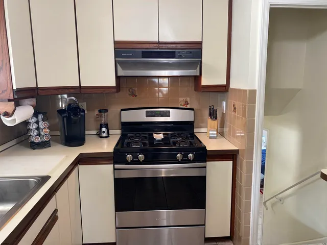 a bedroom with furniture and a lamp