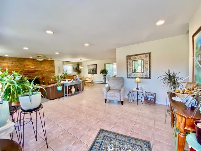 a kitchen with stainless steel appliances granite countertop a stove and a refrigerator