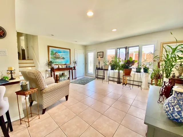 a kitchen with stainless steel appliances a refrigerator and a stove top oven