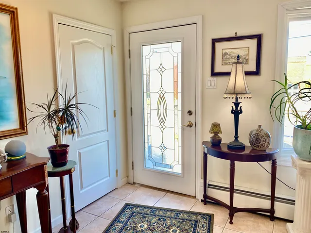 a room with a table and a potted plant