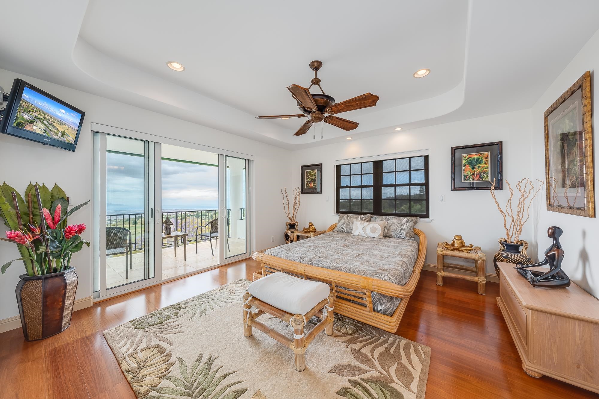 2705 Lower Kula Road Kula, HI 96790 - Photo 12 of 22 a living room with a balcony furniture and a potted plant