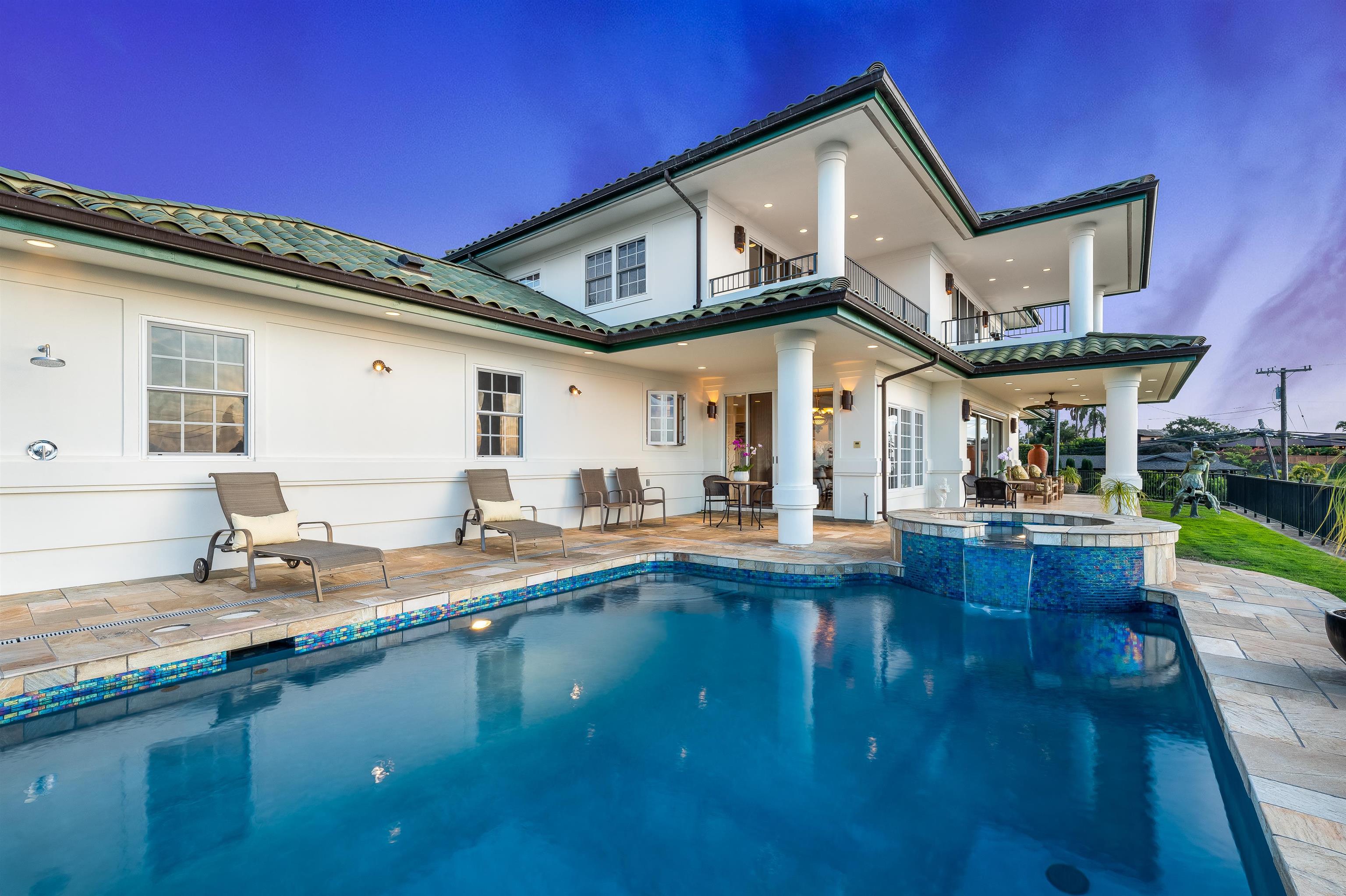 2705 Lower Kula Road Kula, HI 96790 - Photo 21 of 22 a view of a house with pool and chairs
