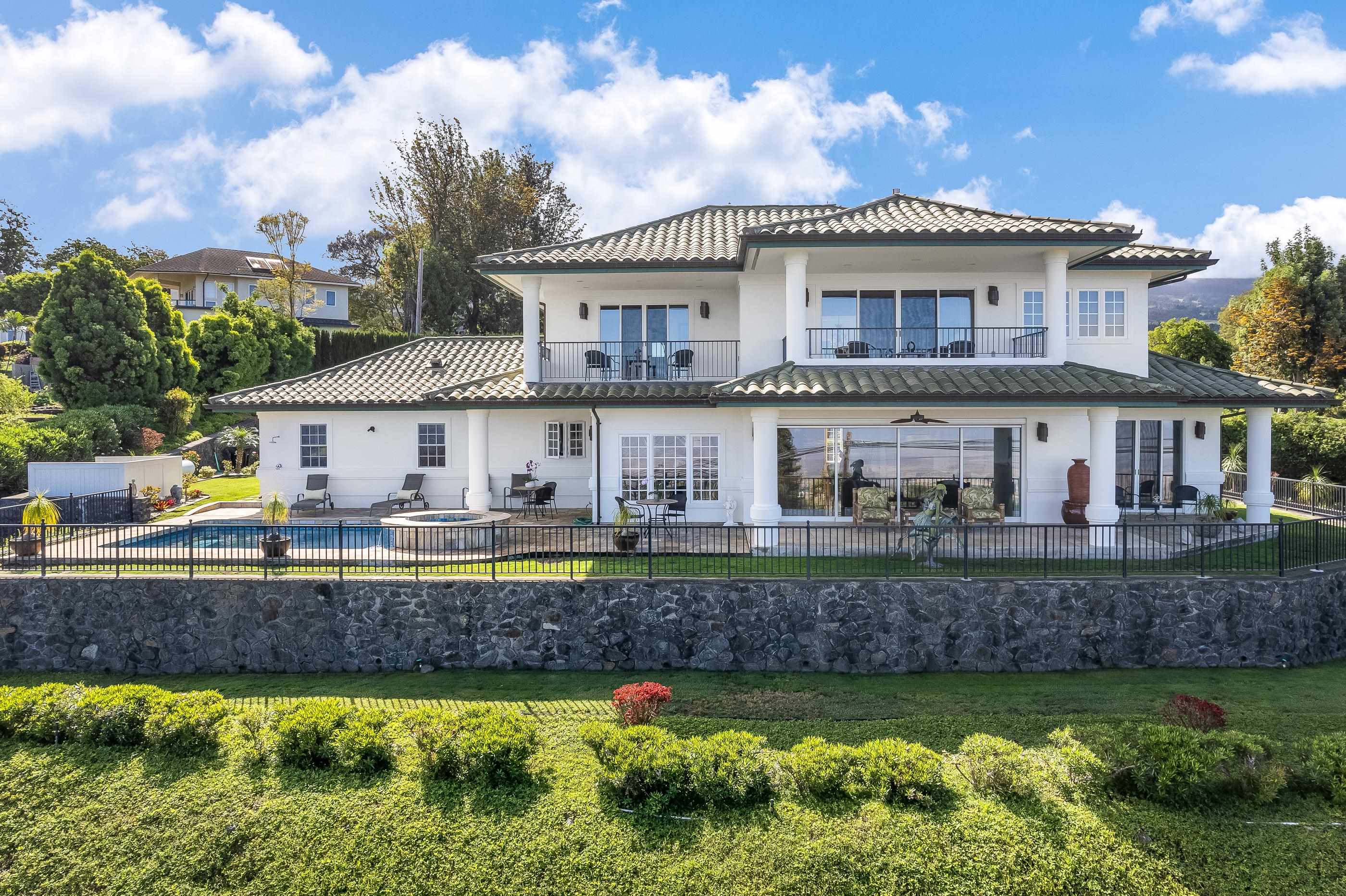2705 Lower Kula Road Kula, HI 96790 - Photo 22 of 22 a front view of a house with a garden and swimming pool