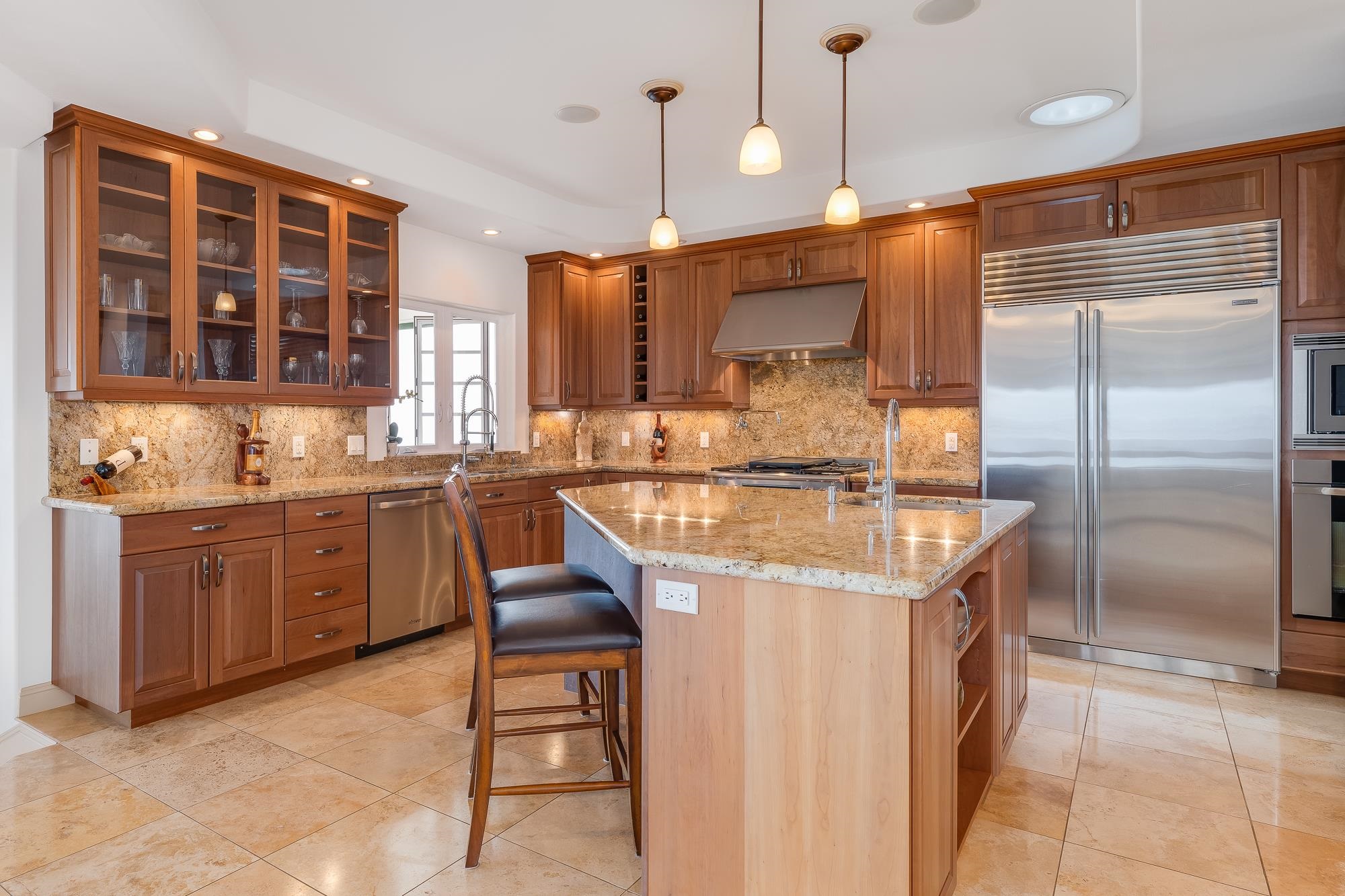 2705 Lower Kula Road Kula, HI 96790 - Photo 4 of 22 a kitchen with a refrigerator a sink and cabinets