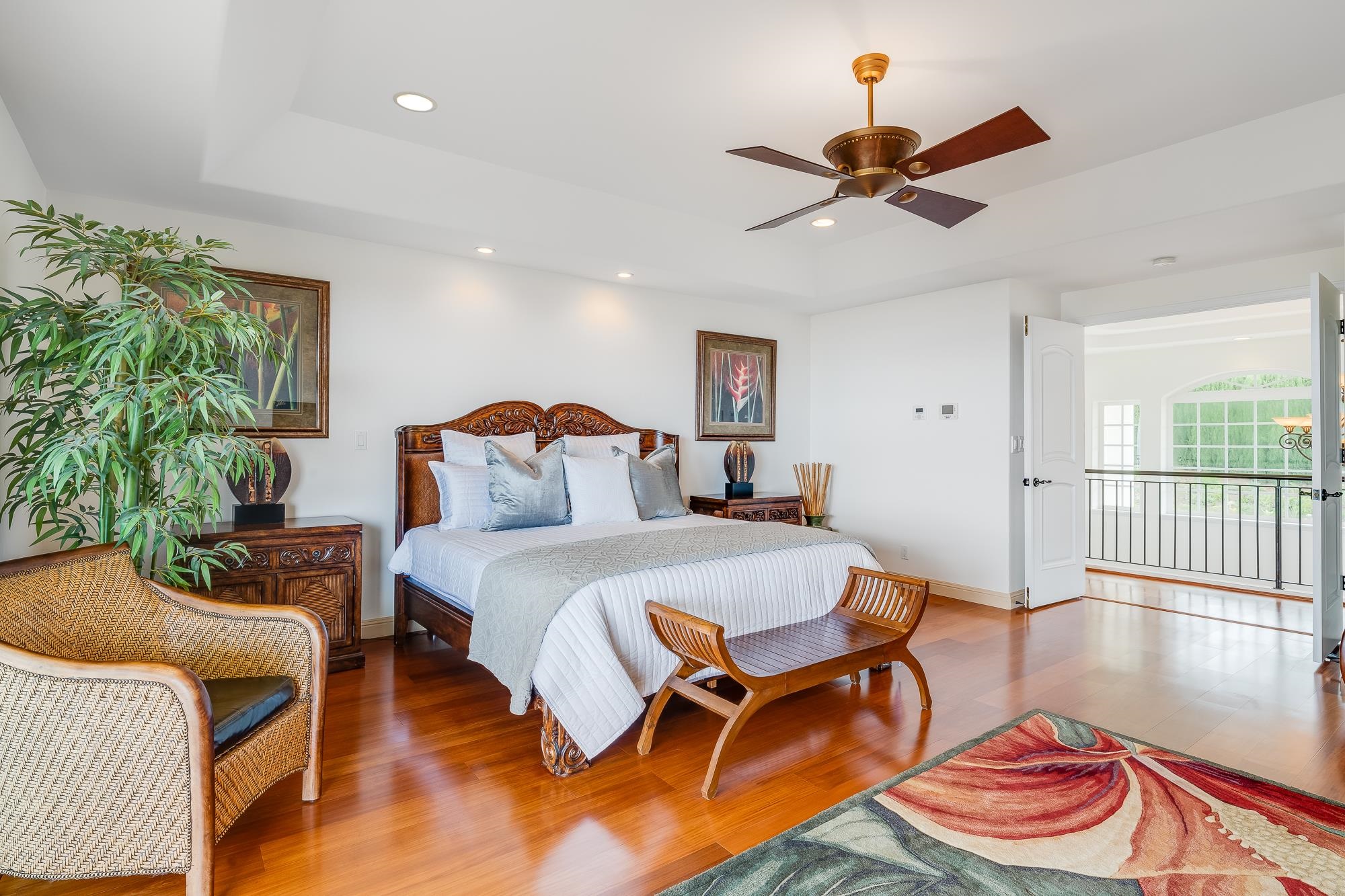 2705 Lower Kula Road Kula, HI 96790 - Photo 8 of 22 a bedroom with furniture and a chandelier