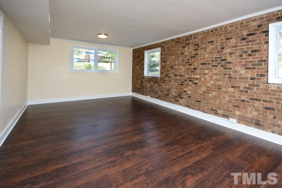 1717 Euclid Road Durham, NC 27713 - Photo 11 of 16 a view of an empty room and wooden floor
