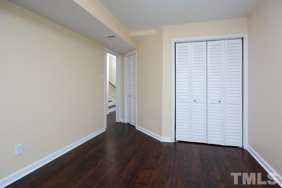1717 Euclid Road Durham, NC 27713 - Photo 12 of 16 wooden floor in an empty room