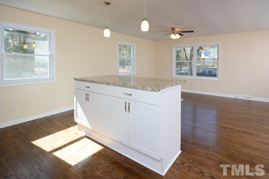 1717 Euclid Road Durham, NC 27713 - Photo 4 of 16 a view of kitchen and hall with wooden floor
