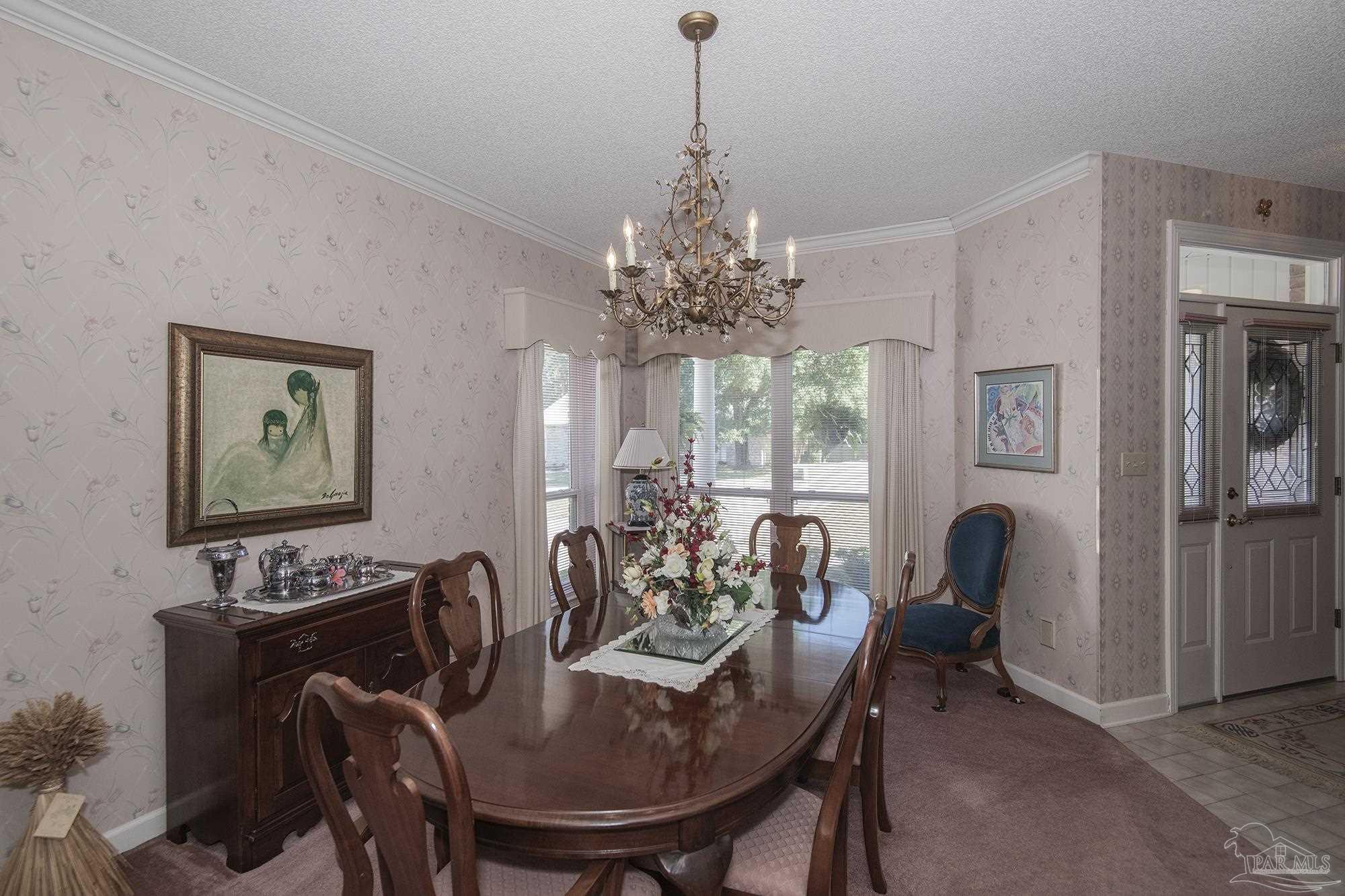 1505 Kings Road Cantonment, FL 32533 - Photo 14 of 57 a view of a dining room with furniture window and outside view