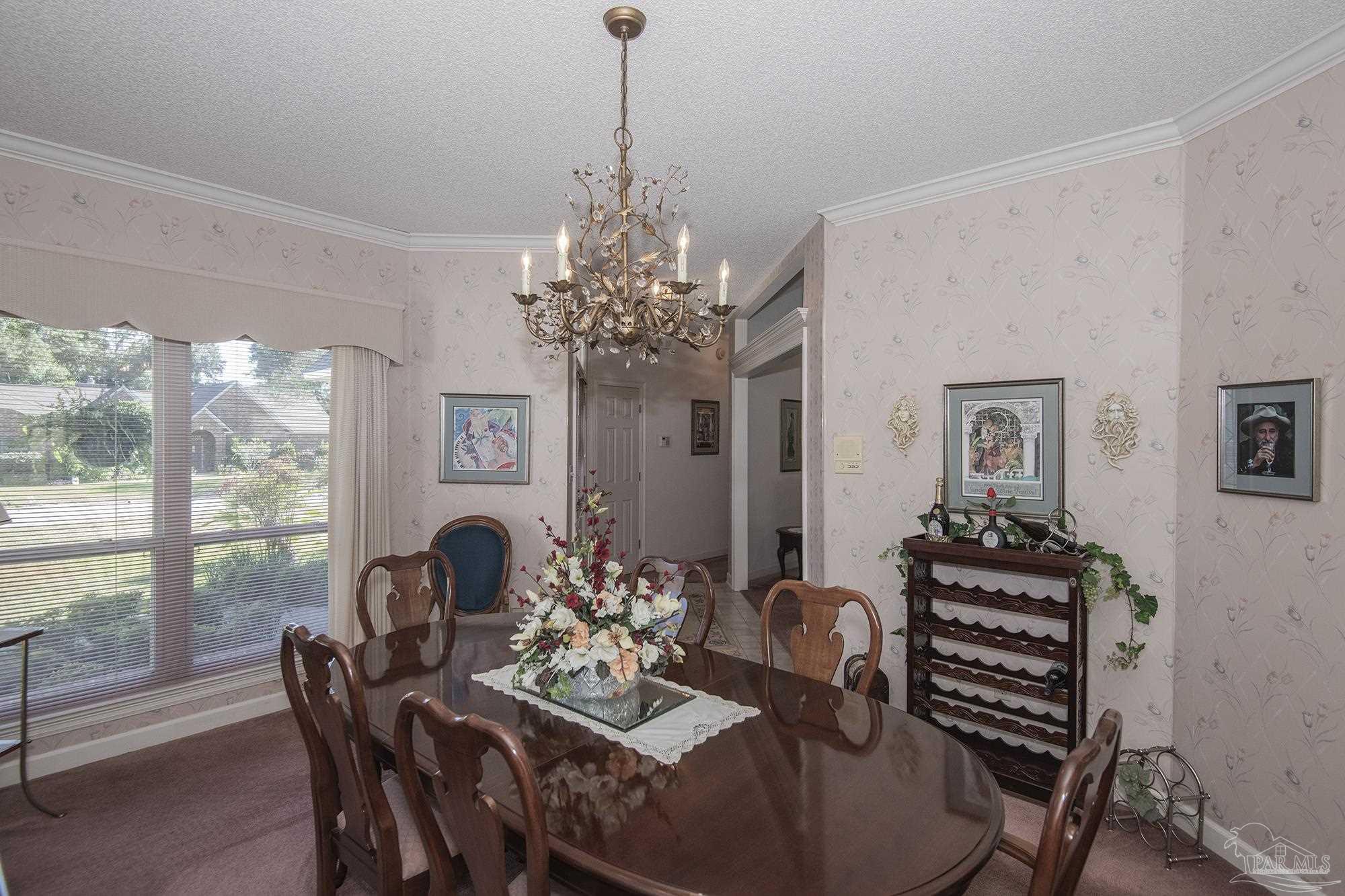 1505 Kings Road Cantonment, FL 32533 - Photo 15 of 57 a view of a dining room with furniture window and outside view