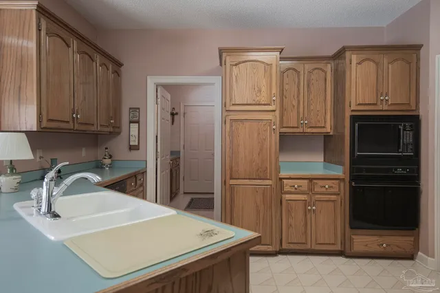 a kitchen with a sink and cabinets