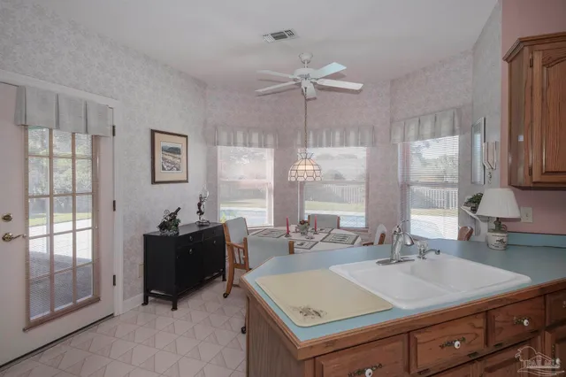 a view of a dining room with furniture window and outside view