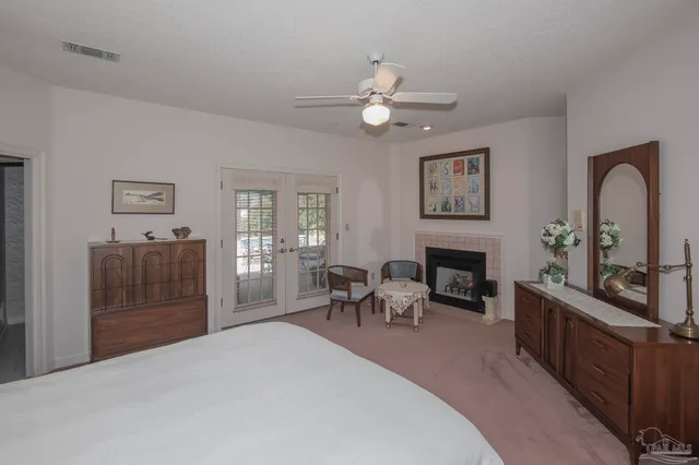 a bathroom with a tub shower vanity and a sink