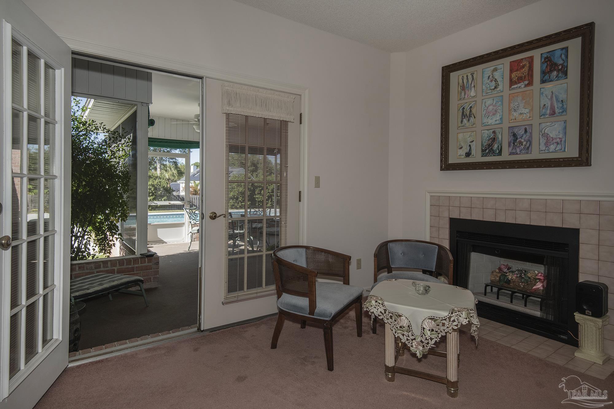 1505 Kings Road Cantonment, FL 32533 - Photo 28 of 57 a living room with furniture and a fireplace