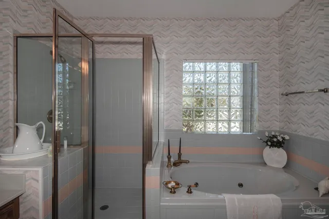 a dining room with furniture and a floor to ceiling window