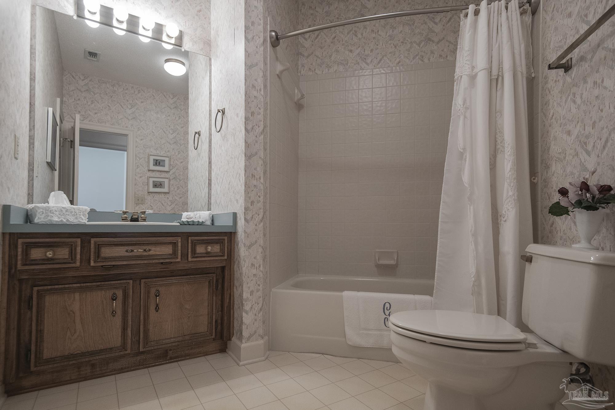 1505 Kings Road Cantonment, FL 32533 - Photo 33 of 57 a bathroom with a sink a toilet and shower