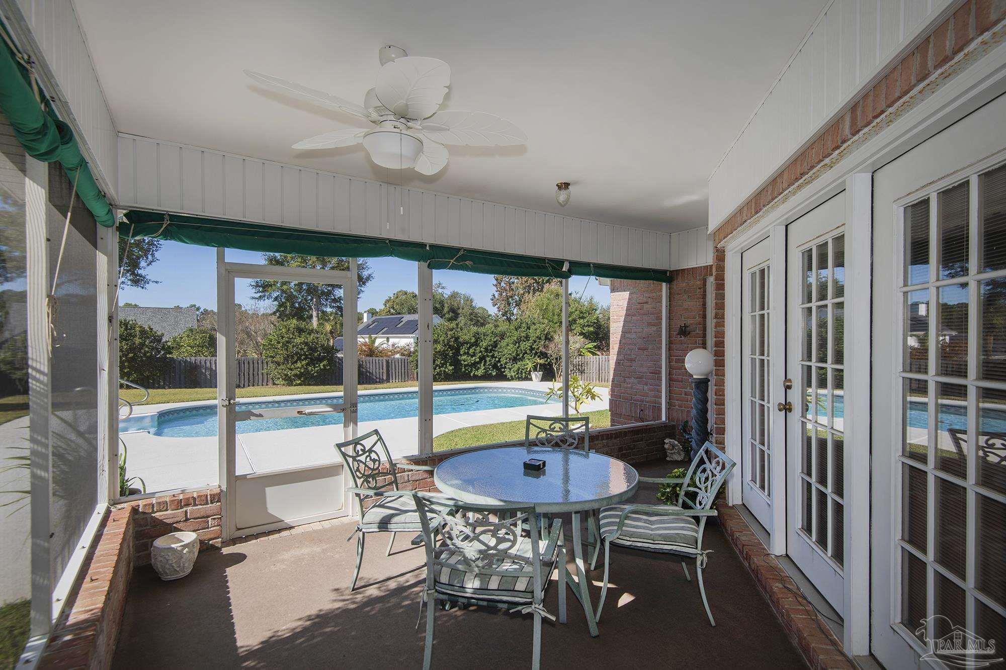 1505 Kings Road Cantonment, FL 32533 - Photo 35 of 57 a view of a dining room with furniture window and outside view