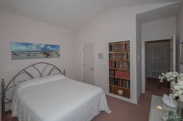 a bedroom with a bed and closet