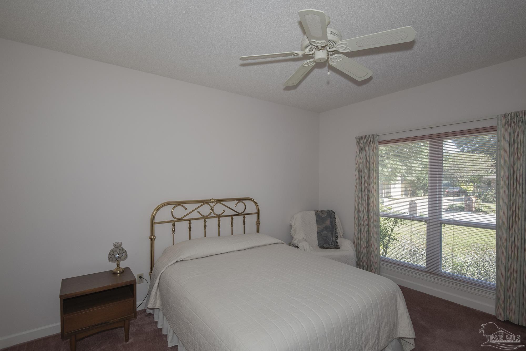 1505 Kings Road Cantonment, FL 32533 - Photo 38 of 57 a bedroom with a bed and a window
