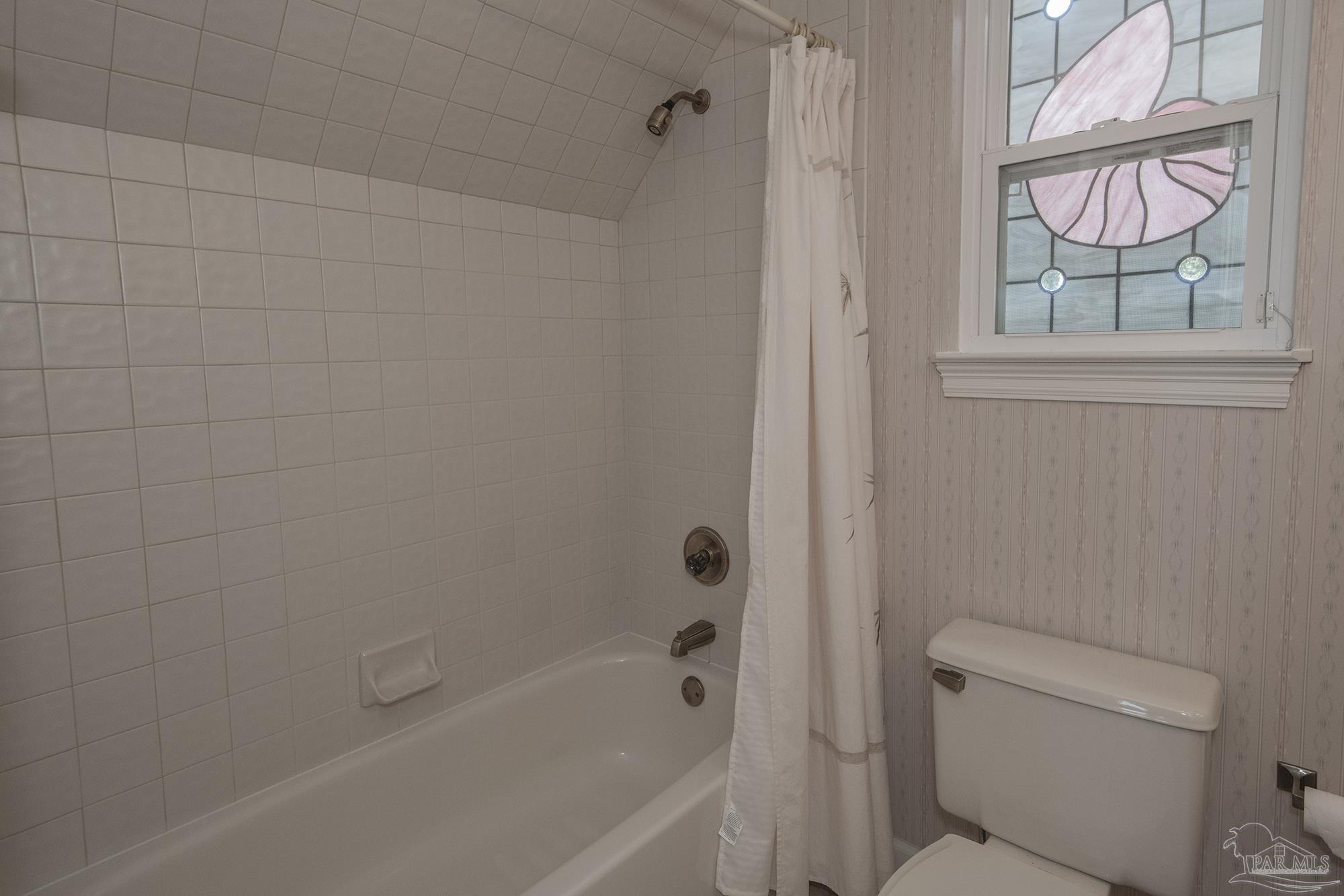 1505 Kings Road Cantonment, FL 32533 - Photo 44 of 57 a bath room with a toilet and a bath tub