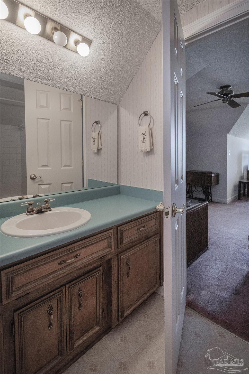 1505 Kings Road Cantonment, FL 32533 - Photo 45 of 57 a bathroom with a sink and a mirror