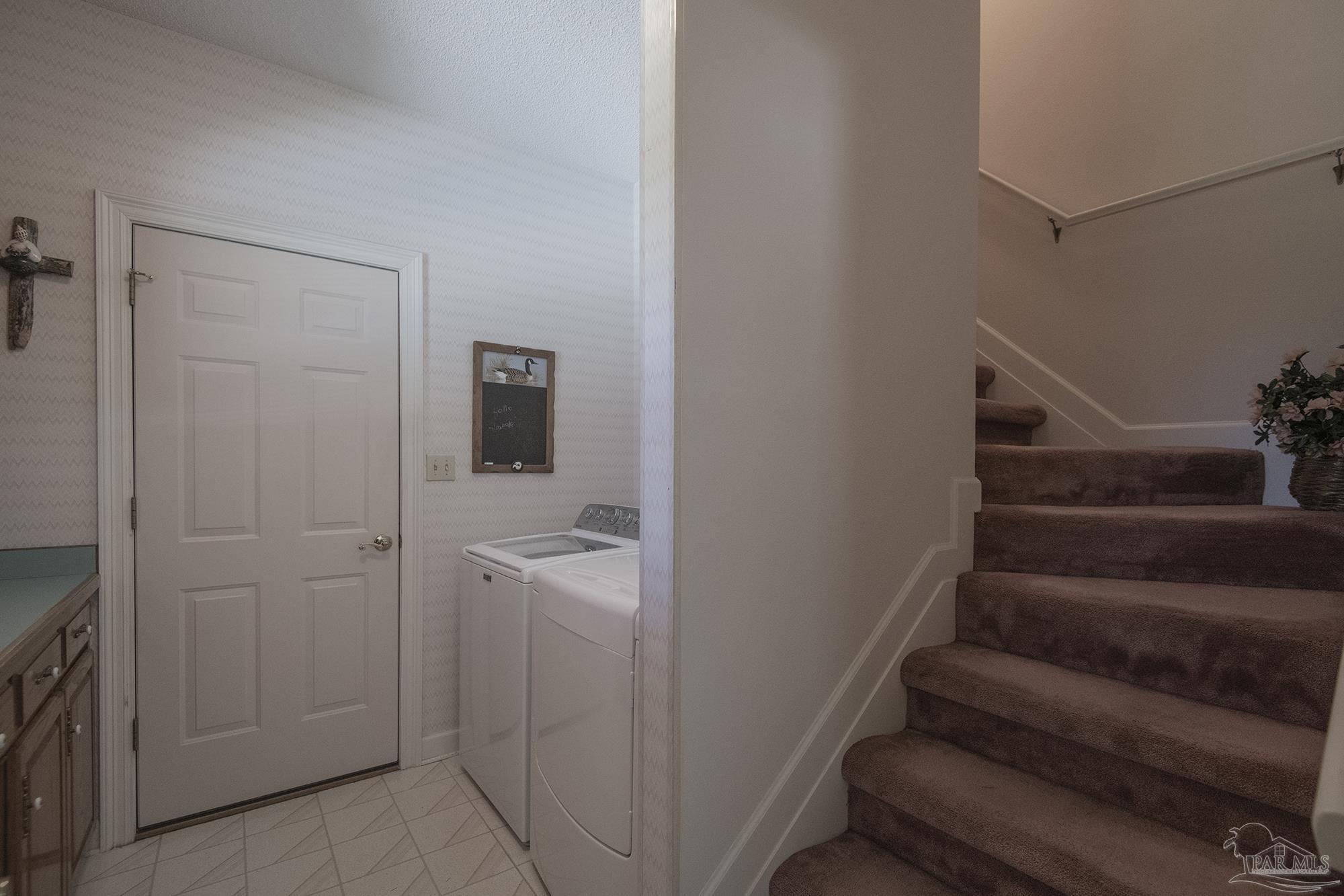 1505 Kings Road Cantonment, FL 32533 - Photo 47 of 57 a view of a hallway with entryway and stairs