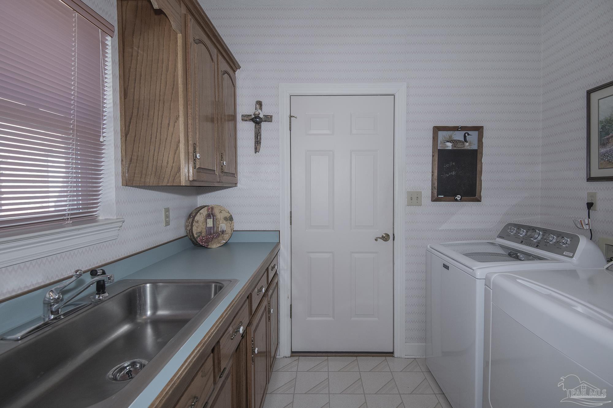 1505 Kings Road Cantonment, FL 32533 - Photo 48 of 57 a kitchen that has a sink and a stove