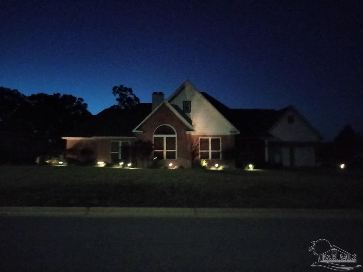 1505 Kings Road Cantonment, FL 32533 - Photo 57 of 57 a front view of a house with yard
