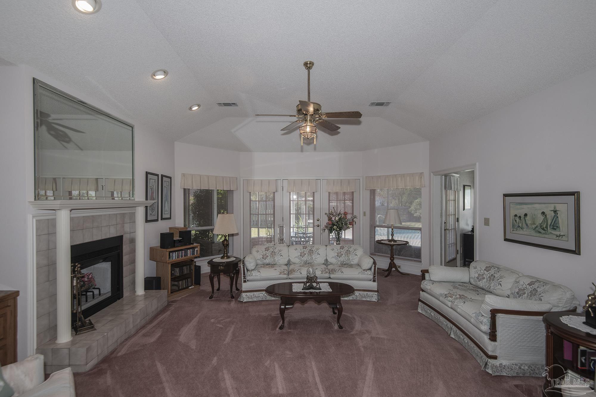 1505 Kings Road Cantonment, FL 32533 - Photo 8 of 57 a living room with furniture and a fireplace