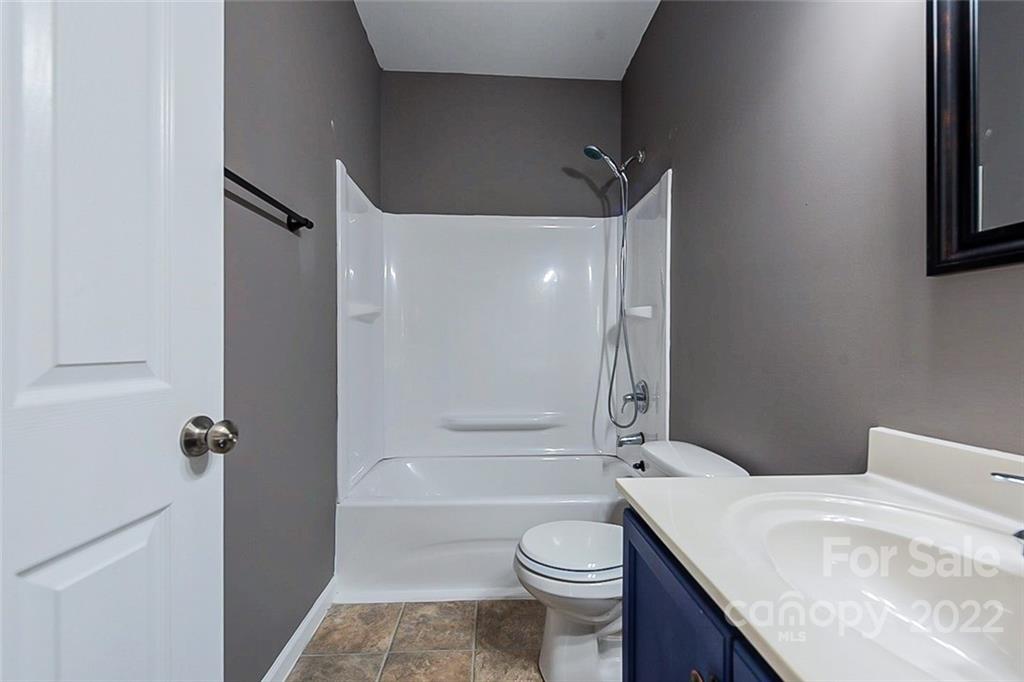 1629 Beleek Ridge Lane Clover, SC 29710 - Photo 16 of 23 a bathroom with a granite countertop sink toilet and shower