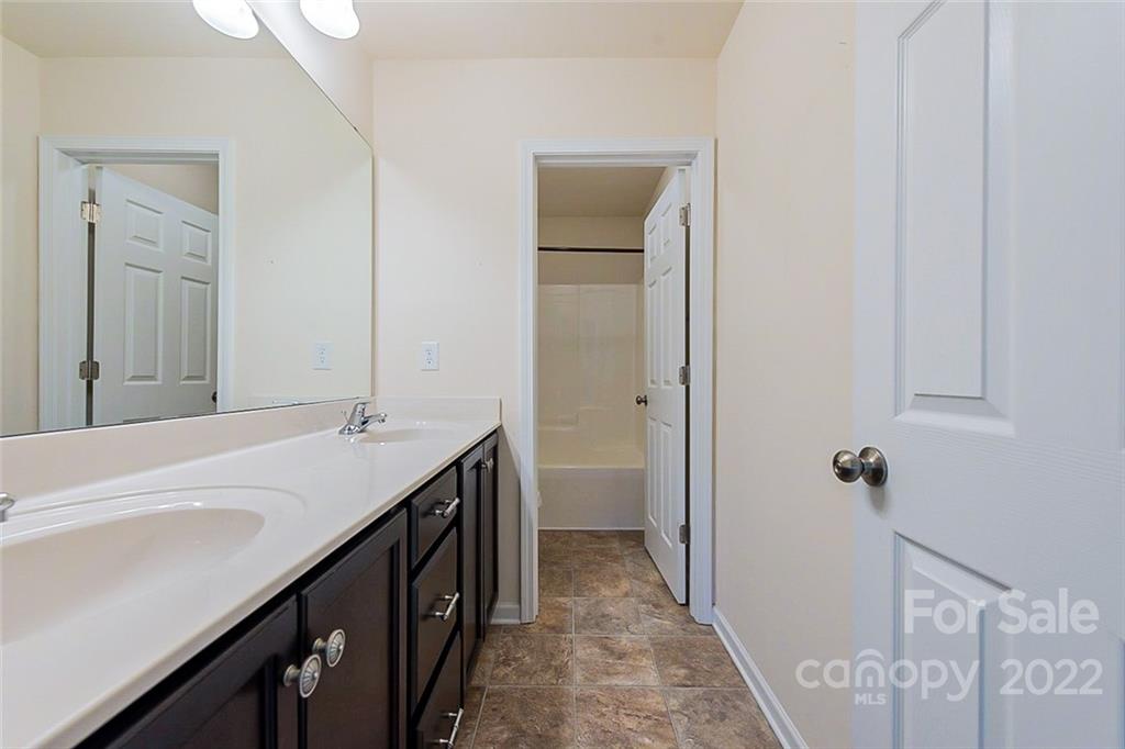 1629 Beleek Ridge Lane Clover, SC 29710 - Photo 17 of 23 a bathroom with a double vanity sink a and mirror