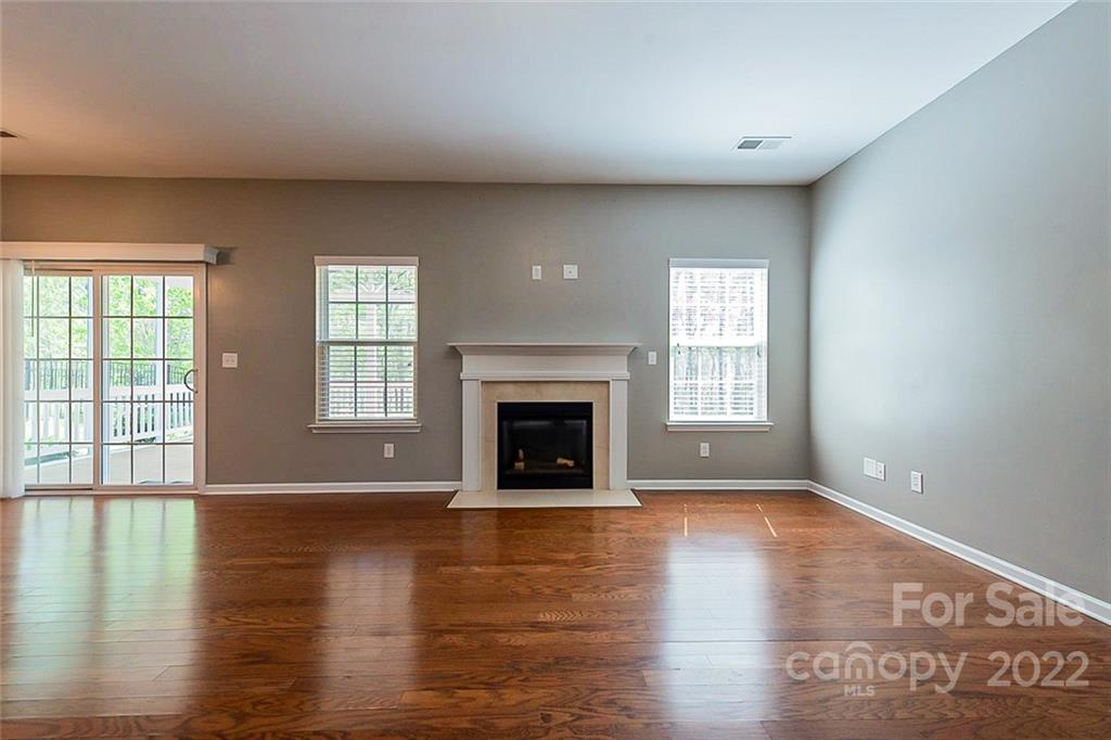 1629 Beleek Ridge Lane Clover, SC 29710 - Photo 3 of 23 wooden floor fireplace and windows in an empty room