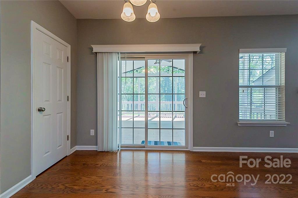 1629 Beleek Ridge Lane Clover, SC 29710 - Photo 4 of 23 a view of an empty room with wooden floor and a window