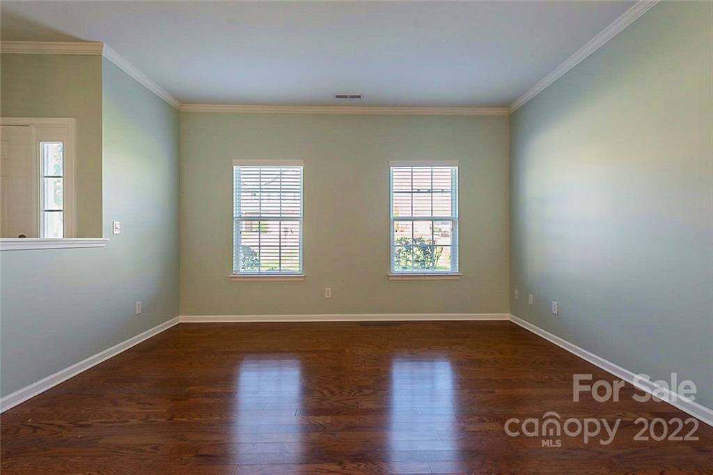 1629 Beleek Ridge Lane Clover, SC 29710 - Photo 6 of 23 an empty room with wooden floor and windows