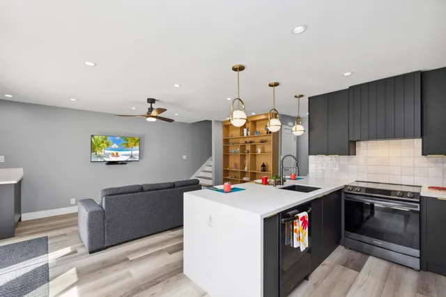 a kitchen that has a stove and a table