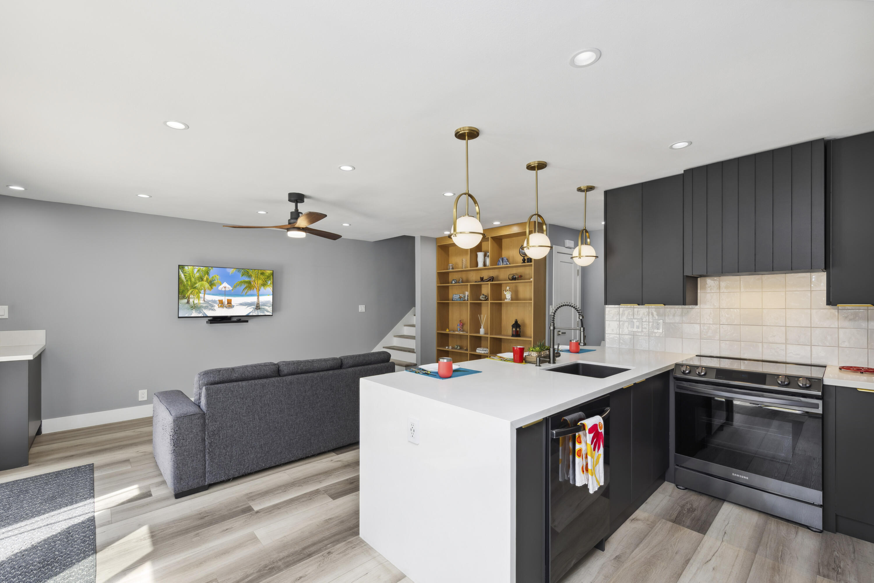 711 Pacific Coast Highway, Unit 206 Huntington Beach, CA 92648 - Photo 12 of 32 a kitchen that has a stove and a table